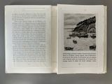 an open book with a picture of a boat in the water