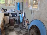an image of a room with a lot of stuff on the floor
