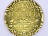 an image of a gold coin with a picture of a boat on it