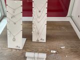 many necklaces and bracelets displayed in a display case