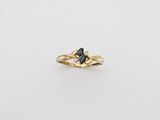 an image of a gold ring with a black diamond