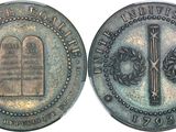 a close up of a coin with a cross on it