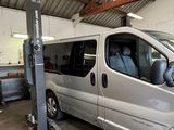 a silver van that is parked in a garage