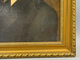 tableau représentant un homme en costume noir et cravate, dans un cadre doré