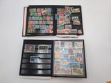 several different types of stamps in a folder on a table