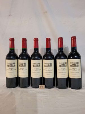 six bottles of wine are lined up on a table