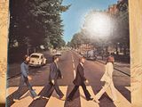 a picture of a picture of the beatles crossing the street
