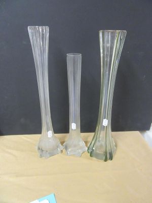 three vases sitting on a table next to each other