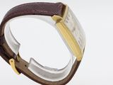 an image of a close up of a wrist watch on a clear surface