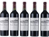 six bottles of red wine are lined up in a row