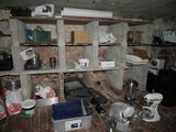 a kitchen with a brick wall and shelves filled with items