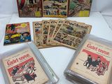 Il y a quelques vieilles bandes dessinées posées sur une table