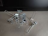 a pile of metal clamps sitting on the floor