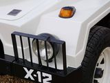 a close up of a white vehicle with a black grill