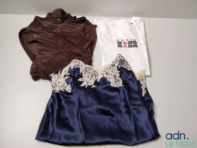 two shirts and a skirt are sitting on a table