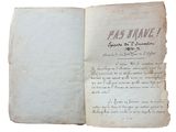 un vieux livre sur lequel on voit des inscriptions sur fond blanc