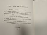 an open book with a black and white picture of a cat on it