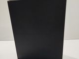a close up of a black box on a white surface