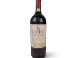 a bottle of wine that is sitting on a table