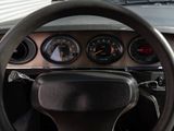 dashboard of a car with a steering wheel and gauges on it