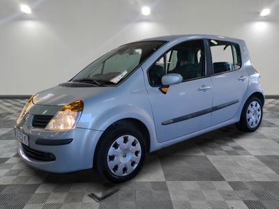 a picture of a small blue car parked in a garage