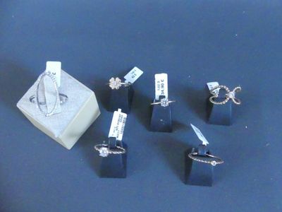 a box of rings and a ring holder on a table
