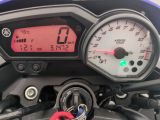 a close up of a speedometer on a motorcycle