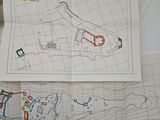 a picture of a map on a table next to a pair of scissors
