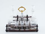 a close up of a glass set on a wooden stand
