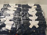 a lot of blue shirts that are wrapped in plastic
