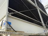 a large air conditioner that is attached to the side of a building