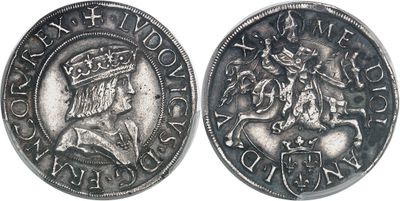 a close up of a coin with a crown on top of it