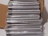 a cardboard box full of cds sitting on a table