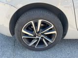 a close up of a car ' s tire on the pavement