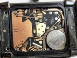 a close up of a wrist watch with a clock on it