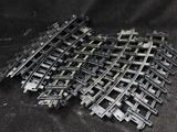 a pile of train tracks that are laying on the ground