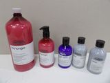 four bottles of shampooe and a bottle of conditioner