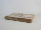 a stack of paper that has been wrapped up on a table