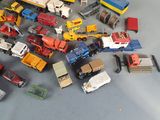a lot of toy trucks that are sitting on the floor