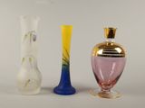 three vases sitting next to each other on a table