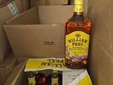 a box of bottles and a bottle of beer on the floor
