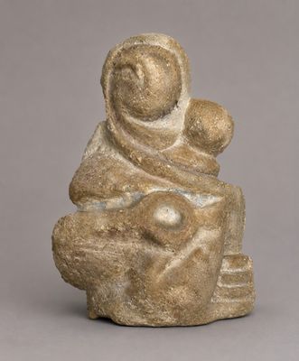 a statue of a woman holding a child on her lap