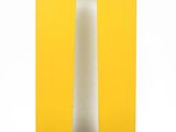 an image of a tall white pillar with a yellow background