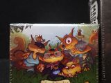 a card game box with a picture of a group of squirrels