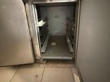 an image of a small open refrigerator in a kitchen