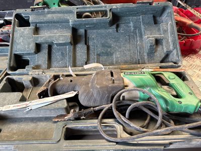 a tool box with tools in it sitting on a table