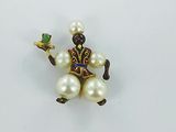 a small figurine of a man holding a tray of food