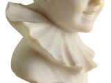 marble bust of a baby with a collar on a white background