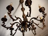 a chandelier that is hanging from the ceiling