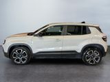 a white suv parked in a showroom with a white wall behind it